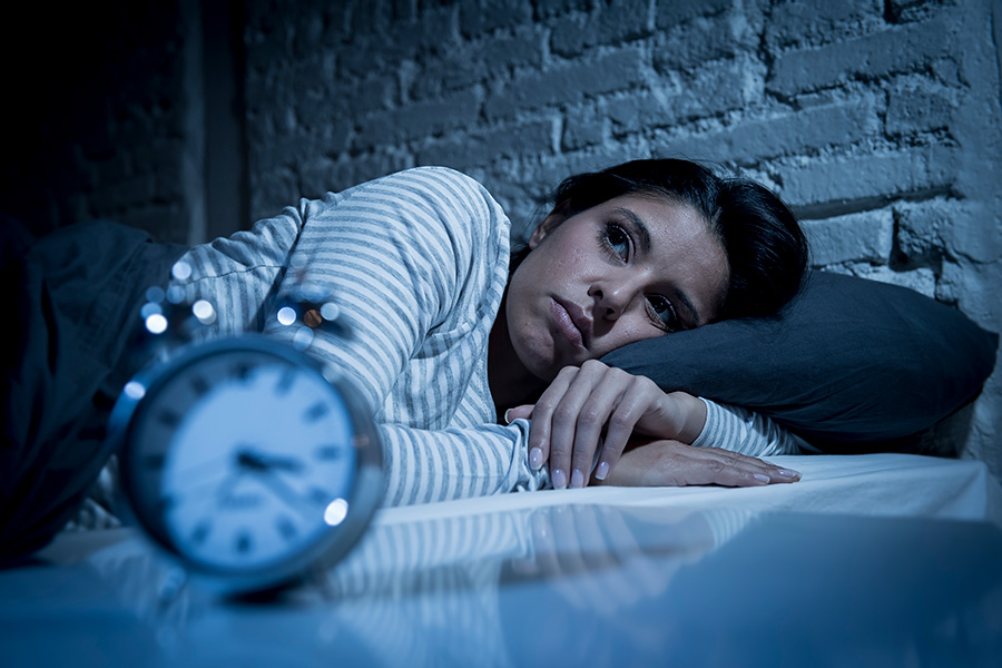 Woman struggling with insomnia seeking sleep disorder treatment in Virginia