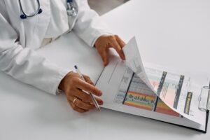 Healthcare professional reviewing assessment records and evaluation data during an adult ADHD diagnostic process..