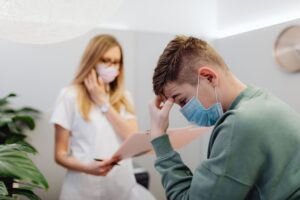 Adult patient discussing attention and concentration challenges with a healthcare professional during an ADHD evaluation appointment..