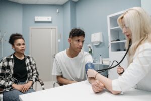 Healthcare professional conducting a medical evaluation as part of a comprehensive adult ADHD assessment process.