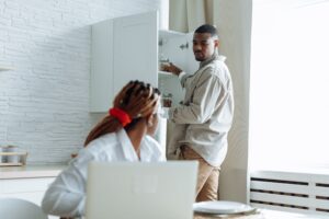 Adult experiencing organizational and task-management difficulties at home, a common challenge associated with ADHD in adults.